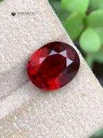 4.47 Ct AIG Certified Natural Malaya Garnet Oval Gemstone - Front View 2